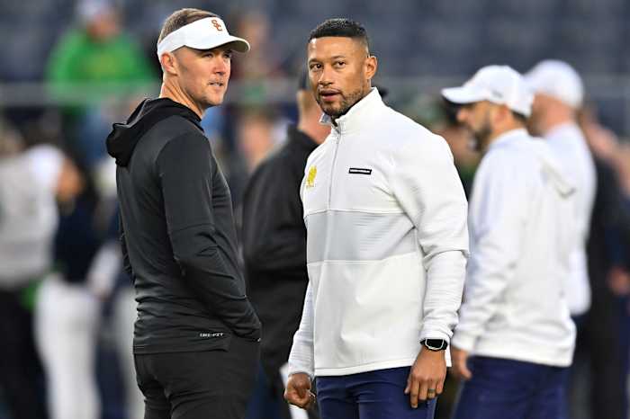 USC Head Coach Lincoln Riley (left) and Notre Dame Head Coach Marcus Freeman (right) ahead of the Trojans' 48-20 defeat at the hands of Notre Dame.